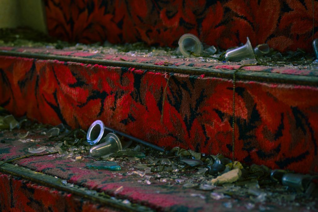 Strange vials and shattered glass on haikyo staircase